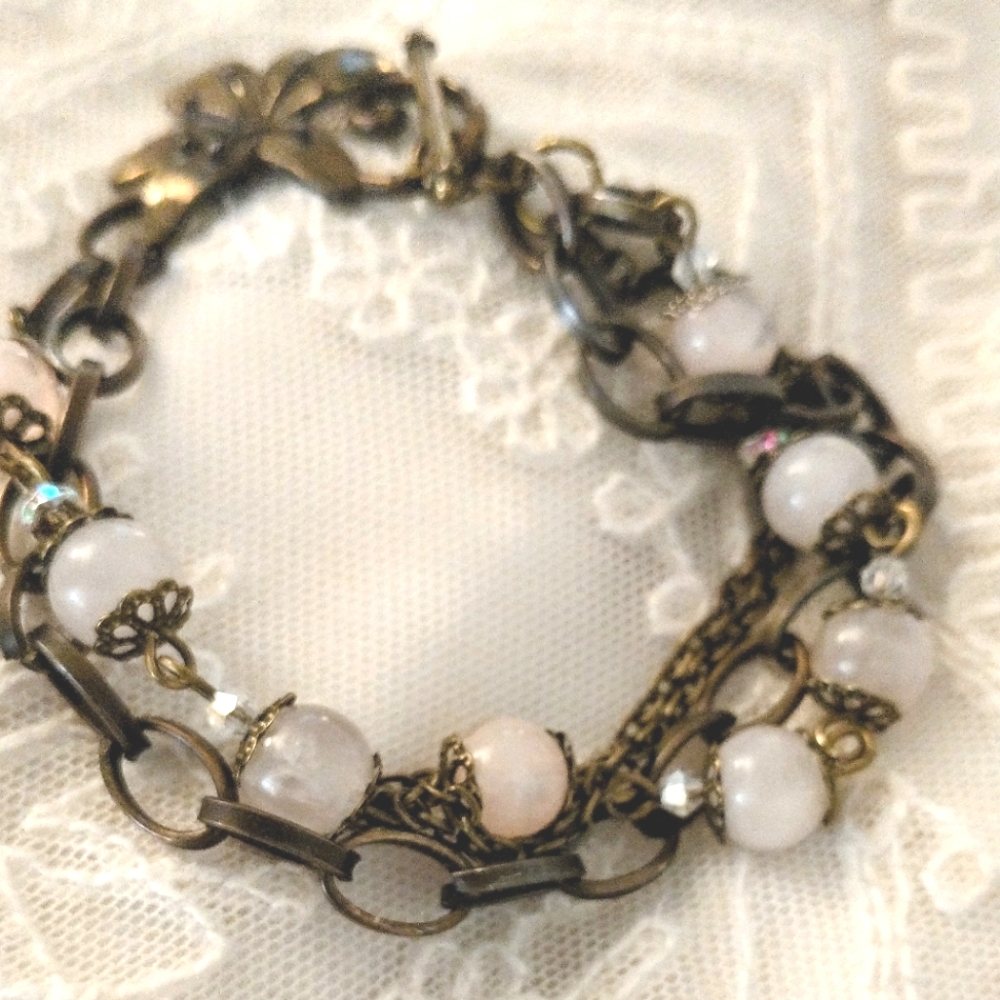 Elegant Multi-Chain Bracelet with Pink and Gold Accents
